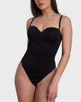A black bustier corset bodysuit with adjustable straps and push-up effect, designed to highlight natural curves and create a silhouette.
