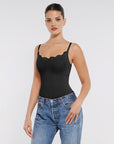 This image features a sleek, black lace detail thong bodysuit. The bodysuit is designed with delicate lace trim at the neckline, adding a touch of elegance.