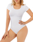 A white short sleeve bodysuit on a female model. The bodysuit has a crew neckline and is form-fitting.