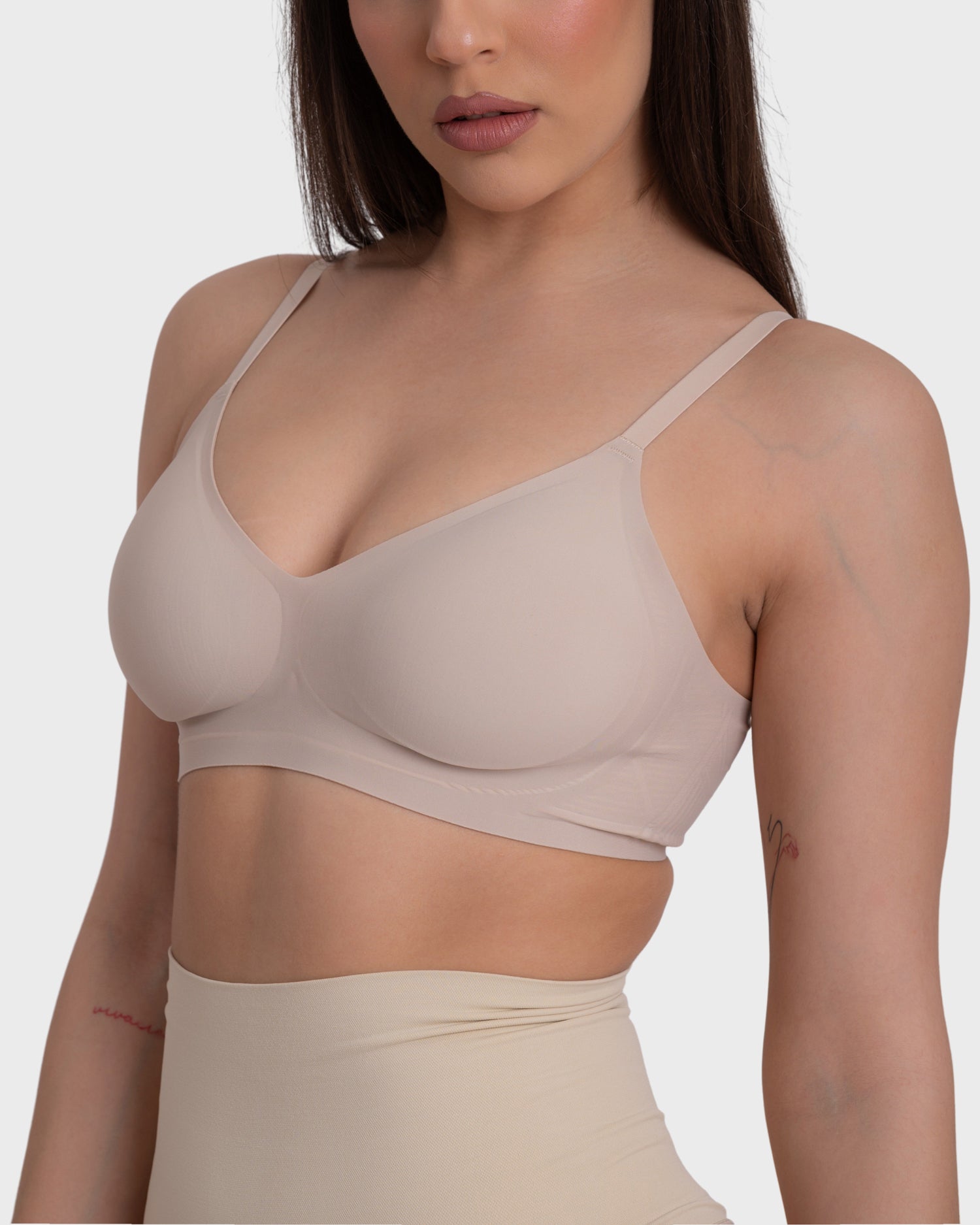 This image features a model wearing the "Everyday Comfort Push Up Bra" in a nude color. The bra is designed for comfort and enhancement, showcasing a smooth and sleek appearance under clothing.