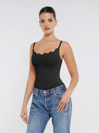 This image features a sleek, black lace detail thong bodysuit. The bodysuit is designed with delicate lace trim at the neckline, adding a touch of elegance.